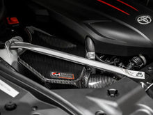 Load image into Gallery viewer, AWE Tuning 2020+ Toyota GR Supra S-FLO Carbon Intake Lid - Corvette Realm