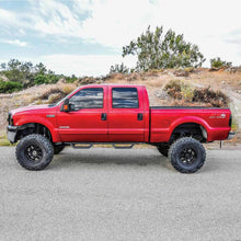 Load image into Gallery viewer, Westin 1999-2016 Ford F-250/F-350/F-450/F-550 Crew Cab Outlaw Drop Nerf Step Bars Textured Black